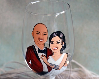 Gift the newlyweds hand-painted wine glasses featuring a delightful portrait of the happy couple,  The perfect wedding gift .