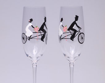Celebrate your journey into forever with these exclusive wedding champagne glasses featuring the bride and groom on a tandem bicycle.