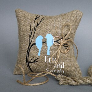 Handcrafted Eco Linen Wedding Ring Pillow, Embellished with Blue Lovebirds on Branch, Symbolizing Eternal Love and Sustainable Elegance.