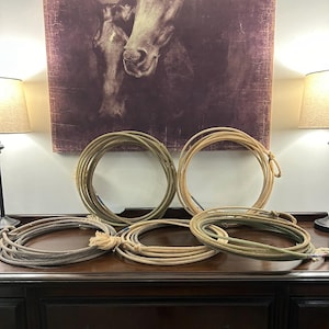 May include: A set of three ceramic mugs with a speckled, matte finish. The mugs are in shades of cream, light gray, and dark gray. Each mug has a simple, minimalist design, perfect for coffee or tea.