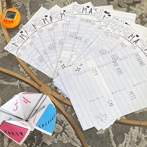 May include: A selection of M.A.S.H. game sheets, a fortune teller, and pencils. The M.A.S.H. sheets are lined paper with the title at the top and categories like "Husband" and "Career". The fortune teller is white with pink and blue panels. A yellow pencil is on the left.