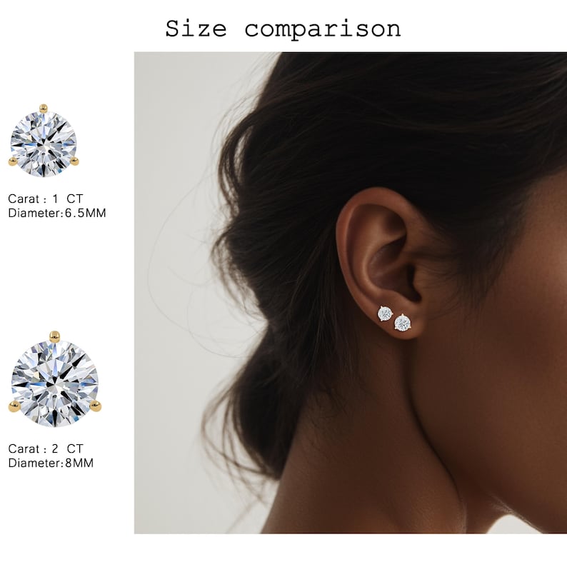 May include: A side-by-side comparison of two diamond stud earrings. The text indicates the size comparison, with one earring at 1 CT and 6.5MM diameter, and the other at 2 CT and 8MM diameter. One earring is shown on an ear.