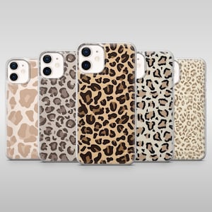 May include: Five phone cases with leopard print patterns. The cases display a range of colours, including tan, brown, and black. The leopard spots vary in size and shape, creating a unique pattern on each case. The cases are made of a clear material.