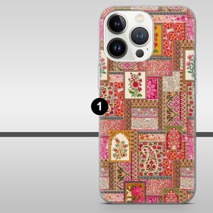 May include: A phone case with a patchwork design in shades of pink, red, and orange. The case features floral and paisley patterns, with a clear camera lens cutout. The overall aesthetic is reminiscent of a vintage textile.