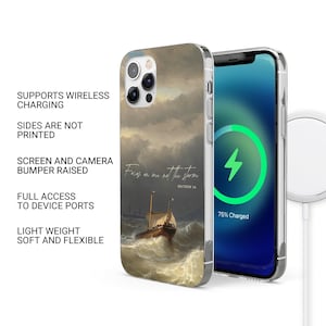May include: A phone case with a painting of a ship sailing through a stormy sea. The text "Focus on me not the storm" and "Matthew 14" are printed on the case.