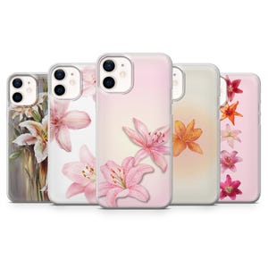May include: Set of five clear phone cases with pink and white floral designs. The cases feature different floral arrangements, including lilies and other flowers.
