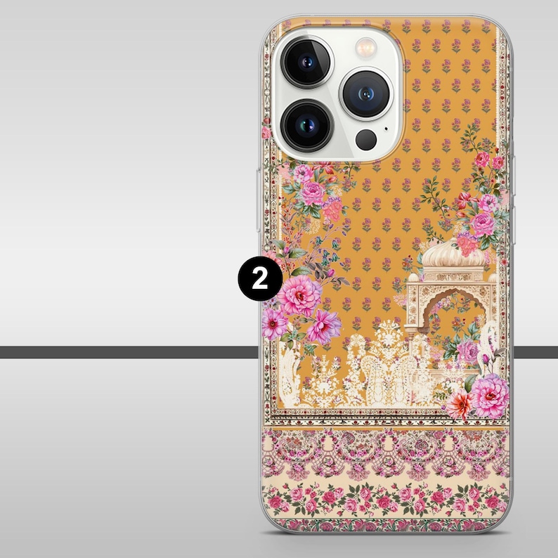 May include: A phone case with a floral design. The case has a mustard yellow background with a repeating pattern of small flowers. Pink and purple flowers and architectural elements are also present.
