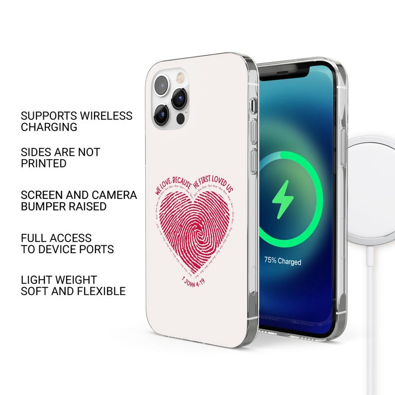 May include: A white phone case with a red heart design featuring a fingerprint and the text "We love because He first loved us. 1 John 4:19". The case is compatible with wireless charging.