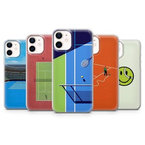 May include: Five different phone cases featuring tennis court designs. The cases are all clear and display the phone's camera lens. The designs include a tennis court with a net, a tennis court with a player, a tennis court with a ball, a tennis court with a smiley face, and a tennis court with a stadium in the background.