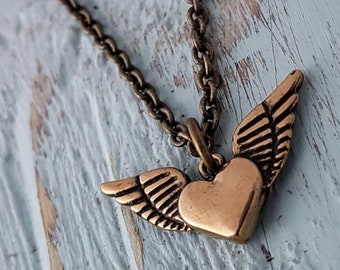 Gold Flying Heart Necklace - Personalized Winged Heart Charm Pendant, Tattoo Jewelry, Angel Wings and Heart Necklace, Unique Heart Jewelry