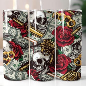 May include: Three stainless steel tumblers with a colorful design featuring skulls, roses, and dollar bills. The design is a mix of gold, red, green, and black.