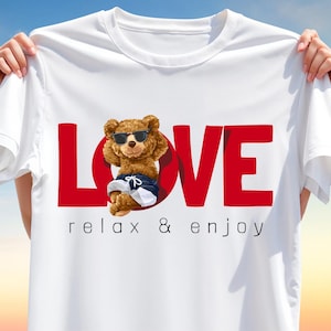 Chill bear wearing sunglasses and beach shorts lounging inside the letter “O” of a bold red LOVE text with “relax & enjoy” message below. Sublimation design.