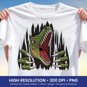 May include: White t-shirt featuring a cartoon dinosaur design. The dinosaur is green with a red mouth and sharp white teeth, appearing to burst through a black background. The shirt has the text "HIGH RESOLUTION • 300 DPI • PNG" at the bottom.