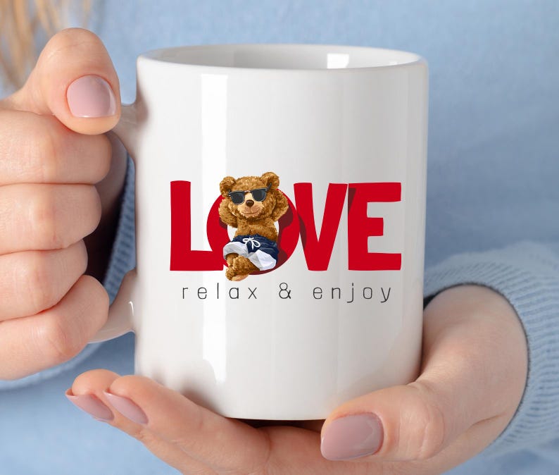 May include: White ceramic mug featuring the word "LOVE" in red block letters. A cartoon bear wearing sunglasses and swim shorts is in the centre. The phrase "relax & enjoy" is printed below the word "LOVE".