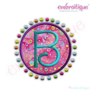 May include: A turquoise letter B in a circle with a pink and white polka dot pattern. The circle is surrounded by a purple ring and a ring of colourful dots.