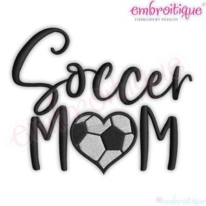 May include: Black embroidered design with the words "Soccer Mom" in a cursive font. The letter "O" in "Mom" is replaced with a heart-shaped soccer ball. The design is on a white background.