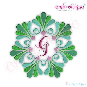 May include: Embroidered monogram design featuring the letter G in pink surrounded by a green and blue floral wreath with hearts.