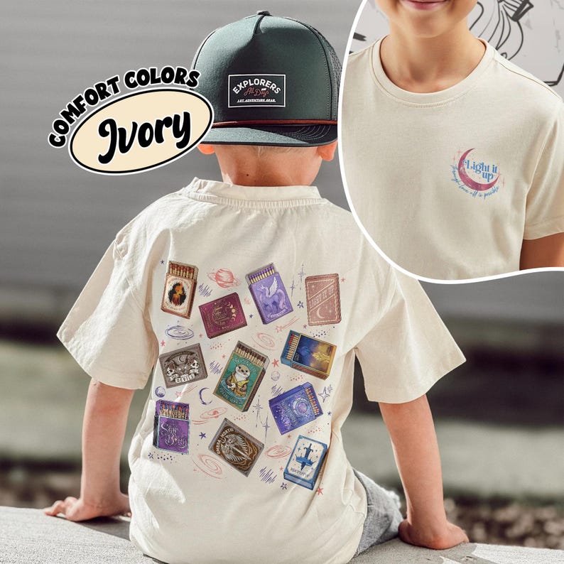 May include: Ivory-colored t-shirt with a graphic of matchboxes, a green and black hat with the text "EXPLORERS", and the text "COMFORT COLORS Ivory". The shirt also has a small graphic that says "Light it up".