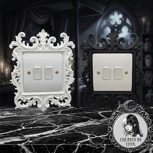 May include: Two double light switch covers featuring ornate, scrollwork frames. One frame is solid white, and the other is solid black. Each switch plate has two rectangular toggles and two small metallic screws. A circular logo with a portrait of a person and the text "CREATED BY LYRA" is in the corner.