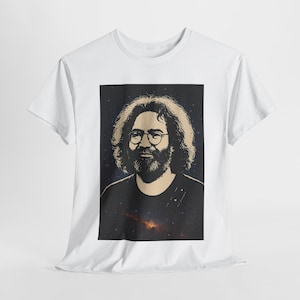 May include: White t-shirt featuring a portrait of a man with curly hair, glasses, and a beard. The portrait is set against a dark background with a starry design. The t-shirt is made of a soft, comfortable material.