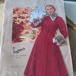 May include: A vintage Simpson's department store catalogue cover featuring a woman wearing a red coat with a fur collar and cuffs. The background is an autumn scene with trees and a path. The text on the cover reads "Simpson's Fall and Winter 1949-50".