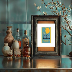 May include: A framed print with a retro design featuring two glasses of whiskey with ice and the text "Old whiskey and toasted dreams".