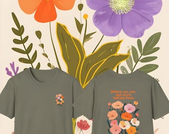 May include: A green t-shirt with a floral design and the text "Believe you can, and you're halfway there." printed on the front. The back of the shirt has a small floral design.