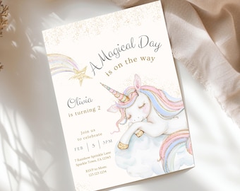 May include: A cream-colored invitation with gold glitter accents features a watercolor illustration of a sleeping unicorn. Text includes "A Magical Day is on the way" and details for Olivia's second birthday.