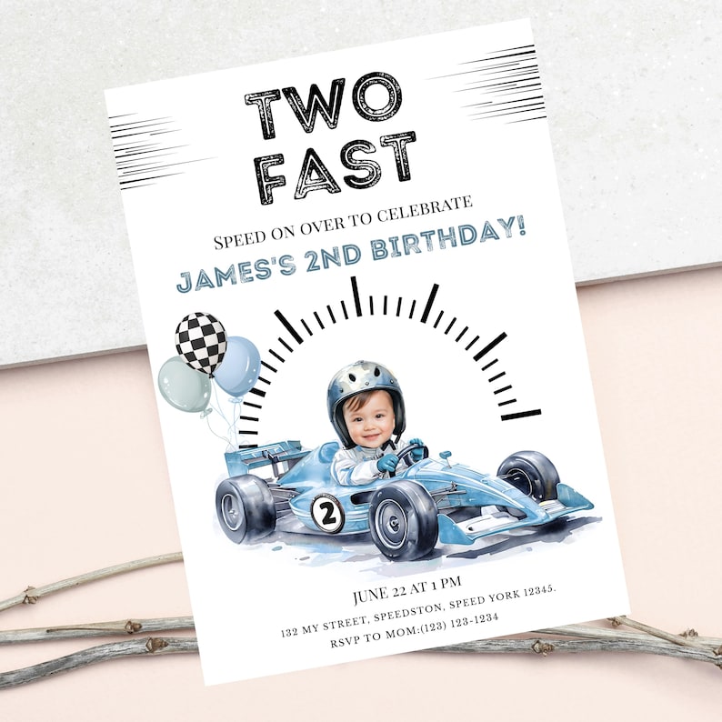 May include: A birthday invitation card featuring the text TWO FAST and JAMES'S 2ND BIRTHDAY. The design includes a child in a helmet driving a light blue race car with the number 2, a speedometer graphic, and three balloons in blue and checkered patterns.