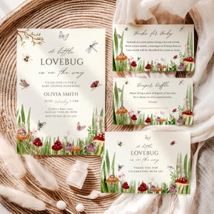 May include: Baby shower invitations with a whimsical design. The invitations feature the text "A little LOVEBUG is on the way" with illustrations of mushrooms, butterflies, and dragonflies. Includes cards for books and a diaper raffle.