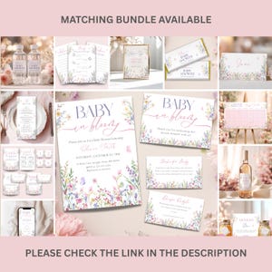 May include: A collection of baby shower stationery with floral designs. The set includes invitations, cards, and signs with the text "Baby in Bloom" and "Baby Shower". The color palette features soft pinks, purples, and greens.