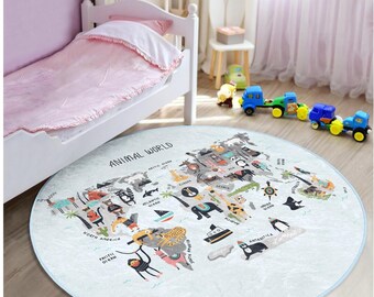 May include: A round, blue and white play rug with a world map design featuring various animals from different continents. The rug has the text "Animal World" printed on it.