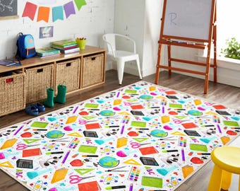 May include: A rectangular area rug with a white background and a colorful pattern of school supplies. The design includes globes, pencils, calculators, scissors, and notebooks. The rug is in a classroom setting.