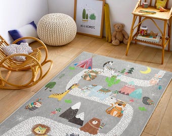 Whimsical Animal Road Trip Rug Kids interactive play mat with a fun animal safari design and a winding road for toy cars.