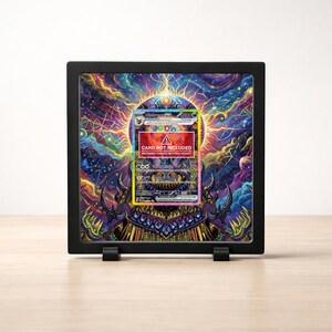 May include: A black display case with a colorful, psychedelic background. The case holds a trading card with the text "CARD NOT INCLUDED". The card features a detailed illustration with various colors and designs. The case is supported by two small black stands.
