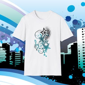 May include: White t-shirt with a musical design. The design features stars, musical notes, and a treble clef in teal and black. The design includes a halftone pattern and decorative swirls. The background has a cityscape silhouette.