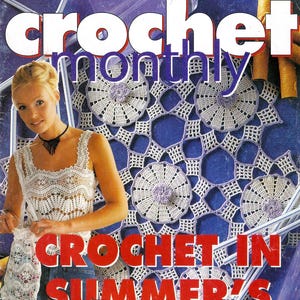 May include: A crochet magazine cover featuring a woman wearing a white crochet top and blue jeans. The cover text reads "crochet monthly" and "crochet in summer's". The background features a close-up of a crocheted doily with a purple and white color scheme.