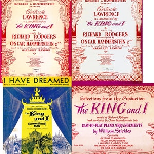 May include: Four vintage playbill covers for the musical "The King and I". The covers are in red, pink, yellow, and blue with ornate borders and text. The covers feature the title "The King and I" and the names of the actors and composers.