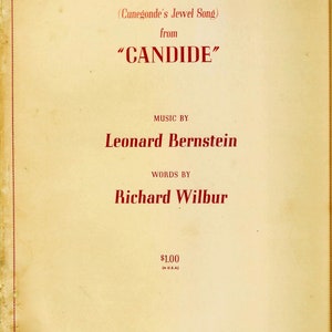 May include: A vintage sheet music cover for the song "Glitter and Be Gay" from the opera "Candide". The music is by Leonard Bernstein and the lyrics are by Richard Wilbur. The cover is printed in red on a cream-colored background.