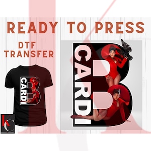 May include: Black t-shirt with a graphic of the letter "B" with the word "Cardi" and an image of a woman in a red bodysuit. The image also shows a DTF transfer design with the words "Ready to Press" and "DTF Transfer".