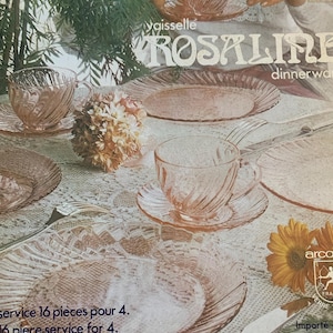 May include: A pink glass dinnerware set called "Rosaline" by Vaisselle. The set includes plates, bowls, and cups. The set is for 4 people and includes 16 pieces. The set is made by Arco France.