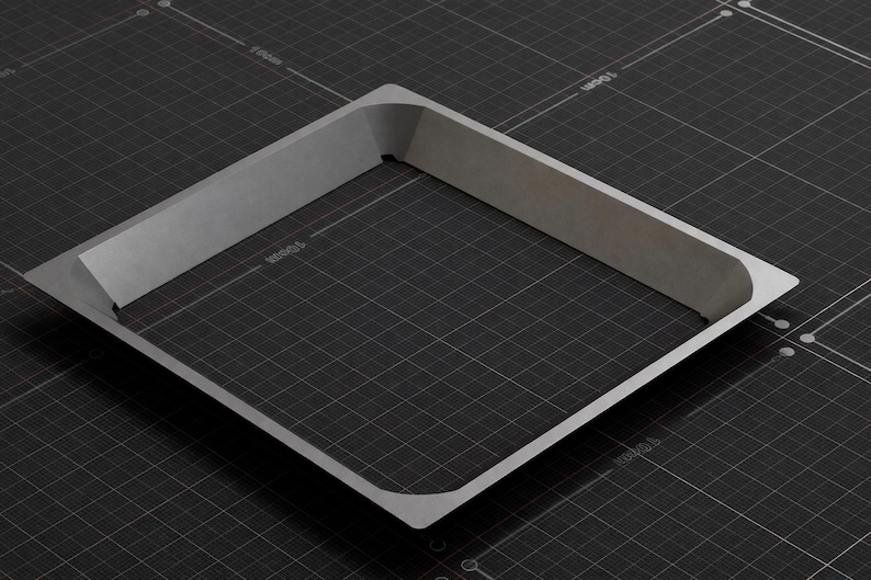 May include: A square, light gray metal frame with rounded corners, set against a dark gray grid background. The frame has a raised, angled edge, creating a three-dimensional effect. The overall design is minimalist and industrial.