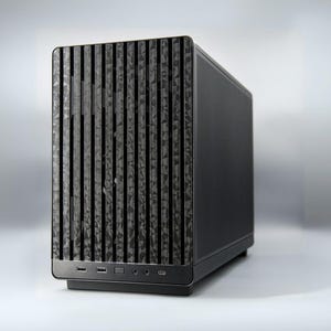 May include: A black computer case with a textured front panel featuring vertical lines and a geometric pattern. The case has a sleek, modern design with ports and buttons on the bottom.
