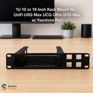 May include: A black 1U 10 or 19-inch rack mount for UniFi UXG-Max, UCG-Ultra, and UCG-Max with a keystone port. The metal frame features a hexagonal mesh base and a front panel with mounting holes and a square cutout for keystone connectivity.