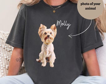 May include: A dark gray t-shirt with a white illustration of a Yorkshire Terrier dog. The dog is sitting and looking at the camera. The text "Molly" is written above the dog.