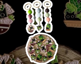 Sleutelhangers met bedel planten en zwarte kat