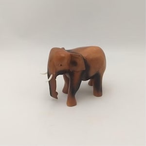 Carved Wooden Elephant Sculpture – Handcrafted Wood Elephant Figurine for Home Decor, Unique Elephant Art, Perfect Gift for Animal Lovers