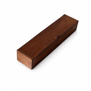 May include: A rectangular wooden box with a dark brown finish and a smooth surface. The box features a hinged lid with a small, centred wooden tab for opening, showcasing a clean, elongated design with visible wood grain patterns throughout.
