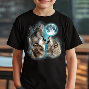May include: Black t-shirt with a graphic of three wolves howling at a full moon. The wolves are silhouetted against a blue and white starry sky.