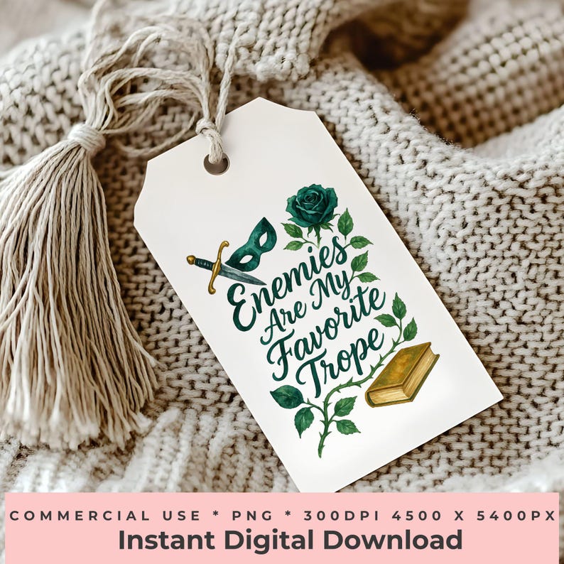 May include: A white tag with the text "Enemies Are My Favorite Trope" in green script, featuring a green rose, a mask, a sword, and a book. The tag is tied with a beige tassel. The bottom of the tag reads "Instant Digital Download".